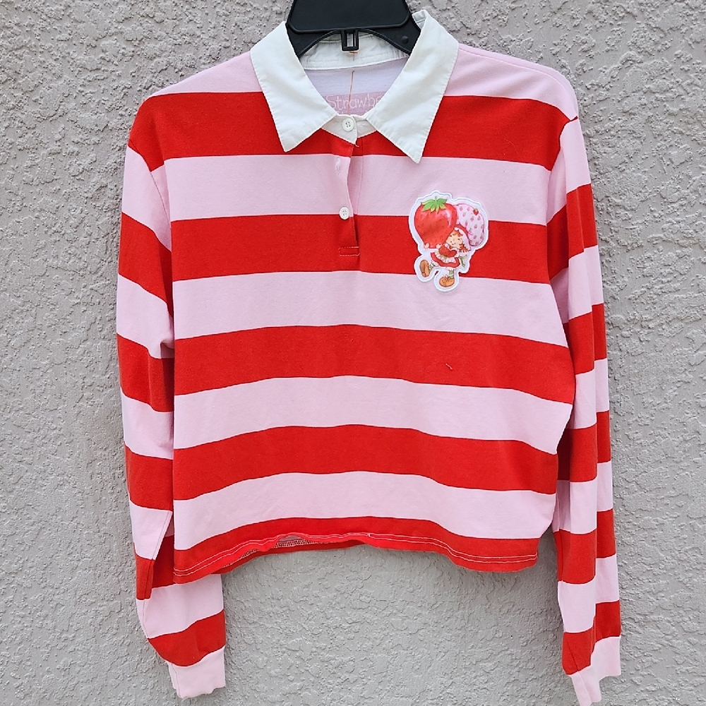 Cakeworthy Strawberry Shortcake Cropped Rugby Shirt in red and pink stripes.
